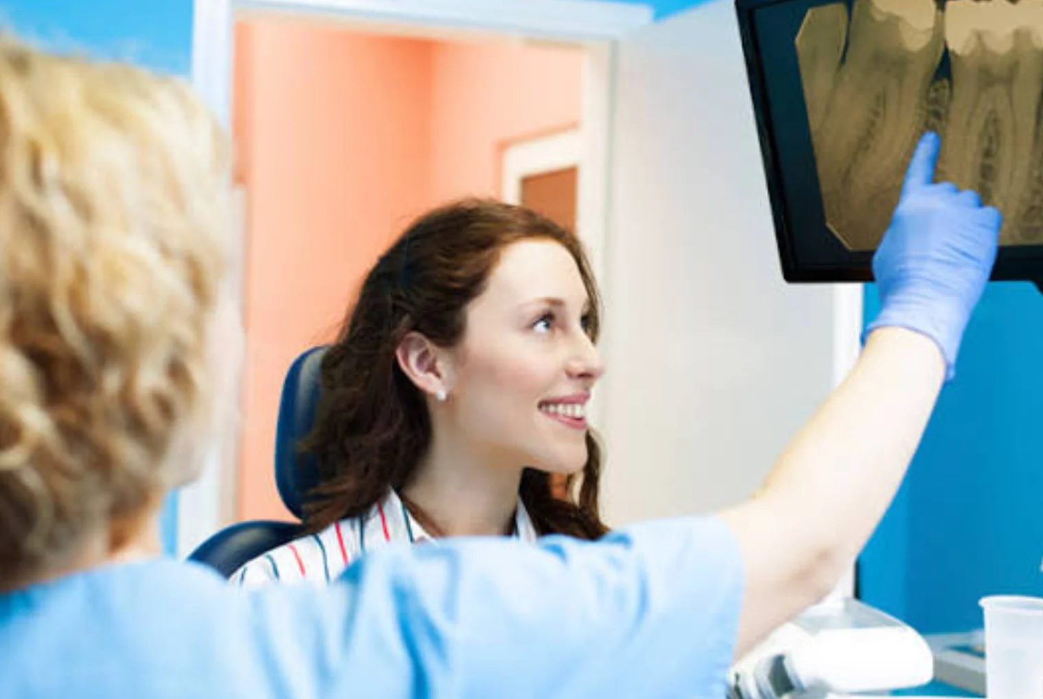 Dentist reviewing a dental scan with a patient at Zeus Dental Clinic in Tirana